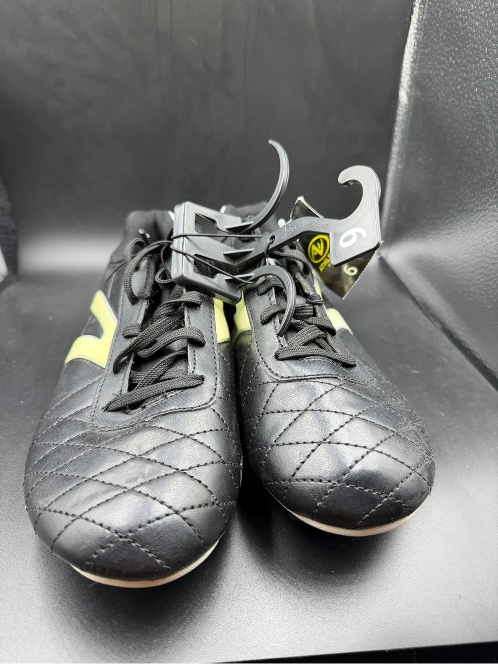 Men's Black Athletic Cleats with Yellow Accent